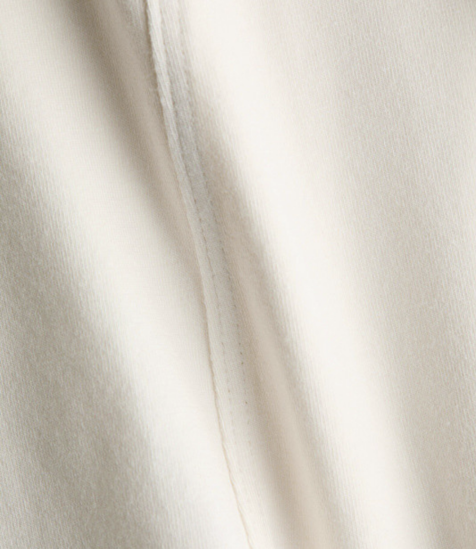 Fitted Long Sleeve Jersey Top With Visible Seams Front And Back Round Neckline